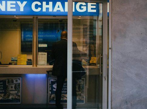 Couple happily discussing finances at a table.