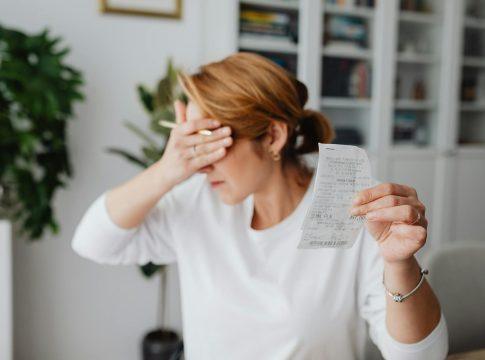 Couple looking at a map, considering moving to a lower cost of living area.