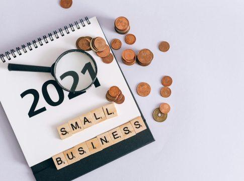 A person working on a laptop, symbolizing a profitable side hustle.