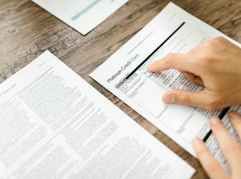 Image illustrating hidden bank fees draining money from a piggy bank.