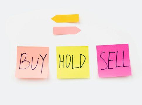 Man looking stressed while reviewing documents with a financial advisor.